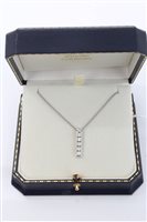 Lot 1589 - White gold (18ct) pendant set with a vertical...