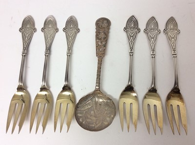 Lot 665 - Set of six Tiffany & Co Sterling cake forks with decorative terminals and engraved monograms, together with a Chinese white metal spoon (7)