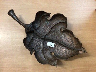 Lot 114 - An unusual hammered brass dish in the form of a leaf, indistinctly inscribed verso