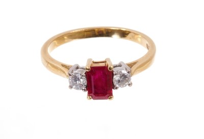 Lot 521 - Ruby and diamond three stone ring with rectangular step cut cut ruby flanked by two brilliant cut diamonds in 18ct gold setting.