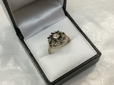 Lot 712 - 9ct Gold Diamond and Garnet cluster ring