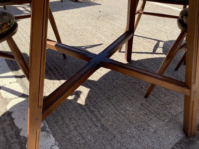 Lot 957 - Ercol drop leaf dining table and a set of four stick back chairs