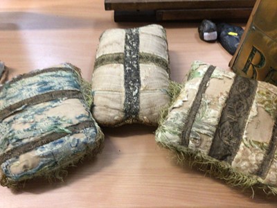 Lot 118 - Three small cushions covered with fragments of 17th/18th century fabrics, another larger, various painted and feather fans and other textiles