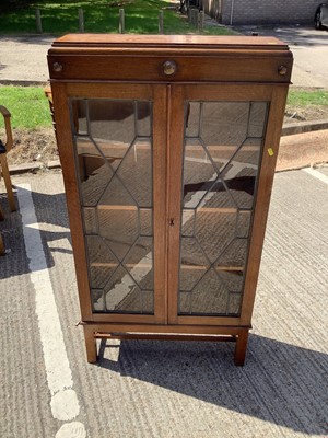 Lot 960 - Oak bookcase with shelved interior enclosed by two leaded glazed doors, 70cm wide, 22.5cm deep, 130cm high