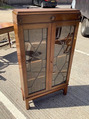 Lot 960 - Oak bookcase with shelved interior enclosed by two leaded glazed doors, 70cm wide, 22.5cm deep, 130cm high