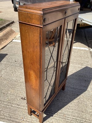 Lot 960 - Oak bookcase with shelved interior enclosed by two leaded glazed doors, 70cm wide, 22.5cm deep, 130cm high