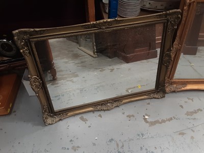 Lot 972 - Bevelled wall mirror in ornate gilt frame, 91cm x 68cm and one other smaller mirror (2)