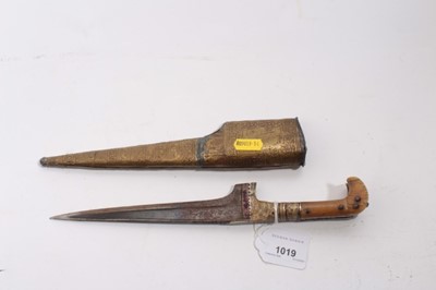 Lot 1019 - Eastern kard knife with rhinoceros horn handle and brass scabbard