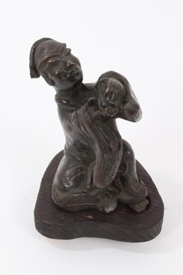 Lot 703 - Chinese bronze figure of a man making a devotional offering, on a later wooden base
