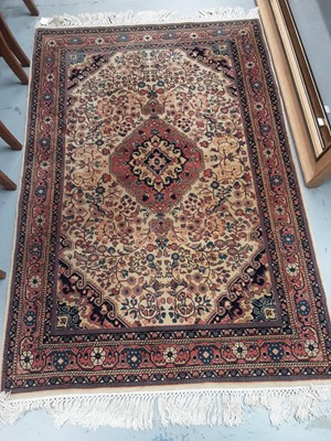 Lot 997 - Eastern rug with geometric decoration on red, blue and beige ground, 166cm x 113cm