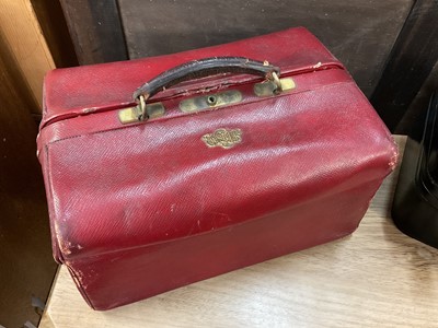 Lot 157 - 1950s black leather vanity case with most original fittings and gilt coronet and initials for the Marchioness of Normanby, together with an Edwardian red leather Pittway Bros. vanity case with appl...
