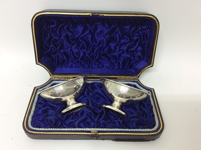 Lot 666 - Pair of Victorian silver salts of boat form with reeded borders, on oval foot, in original fitted case