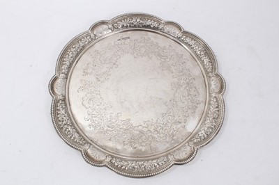 Lot 276 - Victorian silver salver of shaped circular form, with pierced and embossed foliate border