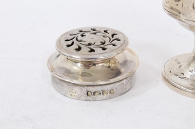 Lot 281 - Georgian silver caster of baluster form with an associated cover, two other Victorian casters