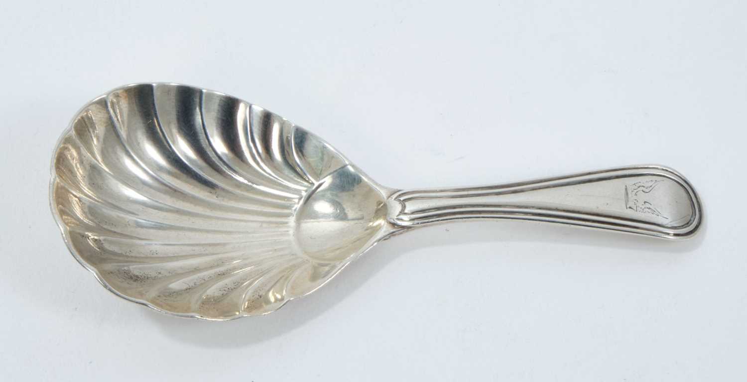 Lot 287 - George III silver caddy spoon with shell bowl and engraved armorial crest (London 1803)