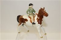 Lot 1000 - Beswick model of a girl on a skewbald pony,...