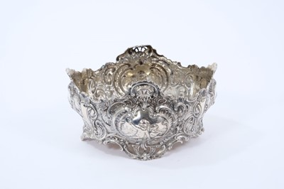Lot 1965 - Late 19th century Dutch silver bowl of oval form, with embossed foliate scroll decoration and panels