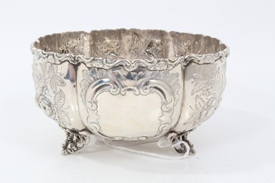 Lot 1967 - Victorian silver sugar bowl with embossed foliate panels, on scroll feet