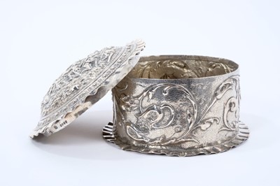 Lot 1963 - Late 19th century German silver box of circular form with ornate embossed