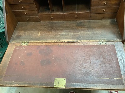 Lot 1025 - Georgian oak bureau with fitted interior and four long graduated drawers below on bracket feet, 99cm wide, 54cm deep, 109cm high