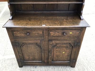 Lot 1033 - Good quality oak two height dresser with shelves above, two drawers and two panelled doors below, 109cm wide, 46cm deep, 185cm high ^