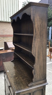 Lot 1033 - Good quality oak two height dresser with shelves above, two drawers and two panelled doors below, 109cm wide, 46cm deep, 185cm high ^