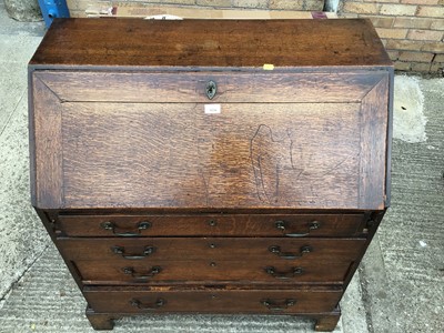 Lot 1034 - Georgian oak bureau with fitted interior and four long graduated drawers below, 90cm wide, 47cm deep, 105cm high