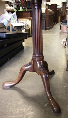 Lot 1036 - Good quality mahogany wine table with circular tilt top on fluted turned column and three hipped splayed legs, 60cm diameter