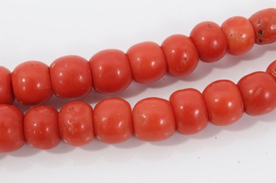 Lot 1995 - Coral bead necklace with a long string of graduated coral beads measuring approximately 5mm to 14mm, length 88cm, together with a turquoise bead necklace