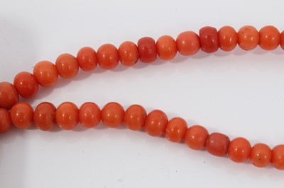 Lot 1995 - Coral bead necklace with a long string of graduated coral beads measuring approximately 5mm to 14mm, length 88cm, together with a turquoise bead necklace