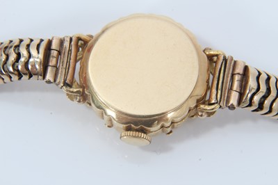 Lot 1996 - 1950s/1960s ladies Ernest Borel gold cocktail wristwatch with ‘mystery’ dial in 18ct gold case on 9ct yellow gold snake link bracelet, length 18cm.
