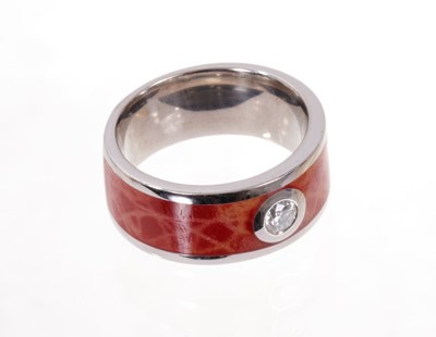 Lot 1974 - Diamond and enamel ring, the round brilliant cut estimated to weigh approximately 0.20cts on a coral enamel and 18ct white gold band. Finger size approximately N.