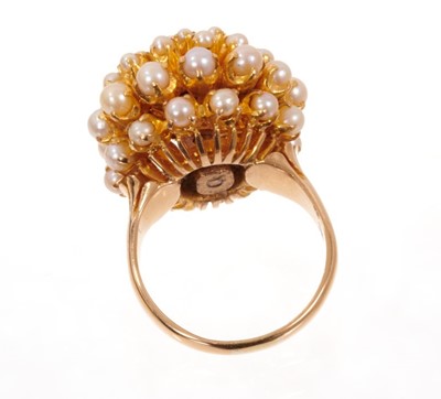 Lot 1982 - Cultured pearl cluster cocktail ring with a domed flower head cluster of cultured pearls in claw setting on yellow gold shank. Finger size approximately O.