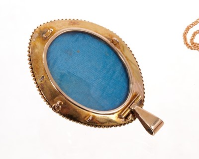 Lot 1985 - Victorian gold enamel and seed pearl pendant converted from a brooch, the oval plaque with applied gold blue enamel and seed pearls, rope twist edge and glazed locket compartment to the reverse, on...