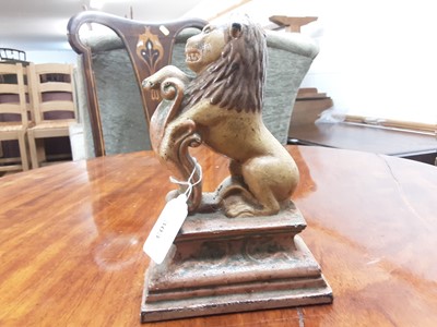 Lot 303 - Antique painted metal door stop in the form of a Lion