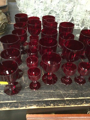 Lot 203 - Quantity of drinking glasses etched with a bamboo pattern, together with a quantity of cranberry drinking glasses