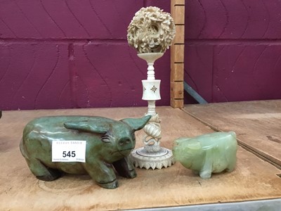 Lot 545 - Two green stone pig ornaments and Chinese carved bone concentric ball ornament on stand