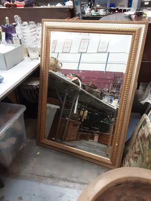 Lot 1063 - Bevelled wall mirror in gilt frame, 108cm x 76cm