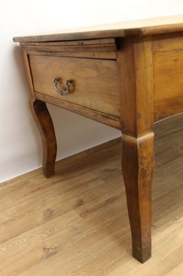 Lot 1439 - 19th century French fruitwood farmhouse table, canted rectangular plank top over end deep drawers and single central frieze drawer on square cabriole legs, 92cm deep x 209cm long  81cm high
