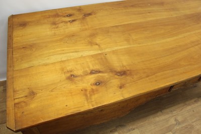Lot 1439 - 19th century French fruitwood farmhouse table, canted rectangular plank top over end deep drawers and single central frieze drawer on square cabriole legs, 92cm deep x 209cm long  81cm high