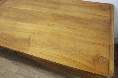 Lot 1439 - 19th century French fruitwood farmhouse table, canted rectangular plank top over end deep drawers and single central frieze drawer on square cabriole legs, 92cm deep x 209cm long  81cm high