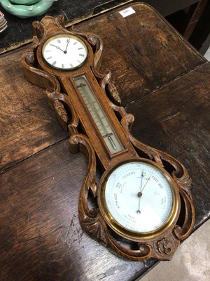 Lot 221 - Oak carved combination barometer, clock and thermometer