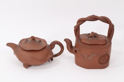 Lot 146 - Two interesting Chinese terracotta teapots, one depicting lotus leaf with frog and snail