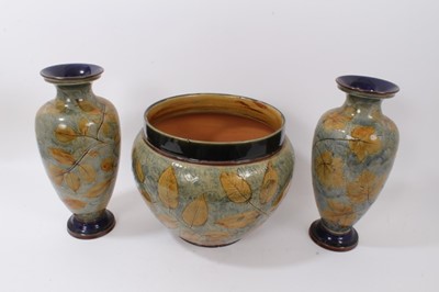 Lot 1158 - Large pair of Doulton lambeth vases, leaf pattern on green background together with large jardiniere
