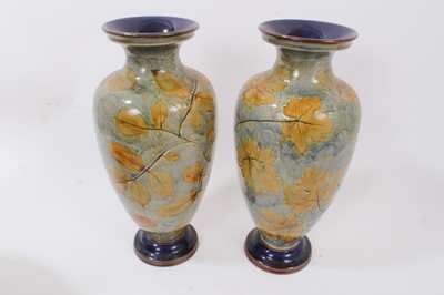 Lot 1158 - Large pair of Doulton lambeth vases, leaf pattern on green background together with large jardiniere