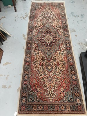 Lot 1091 - Eastern runner with geometric decoration on multi coloured ground, 232cm x 79cm