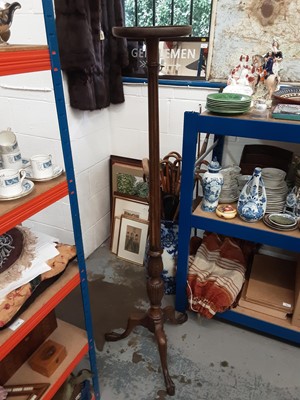 Lot 1096 - Mahogany torchere with circular top on fluted and reeded column and three hipped splayed legs with claw feet