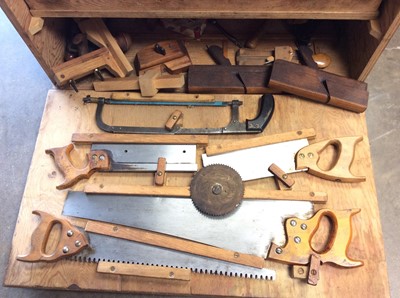 Lot 592 - Large wooden tool chest containing old hand tools, saws etc