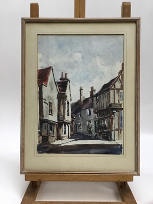 Lot 73 - Mid 20th century watercolour of a interior with vase of flowers, indistinctly signed, together with a 1950s watercolour of a Colchester street scene, signed (the artist believed to have been a Poli...