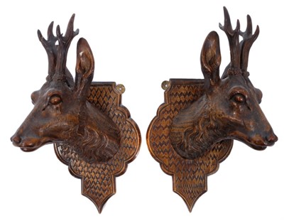 Lot 818 - Pair of late 19th / early 20th century carved Black Forest deer trophy heads